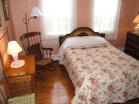 Room 29 One queen bed shares a bath with Room 30, a larger room, with one double and one twin bed